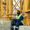Construction worker sitting outdoors