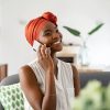 Mature african woman talking over phone